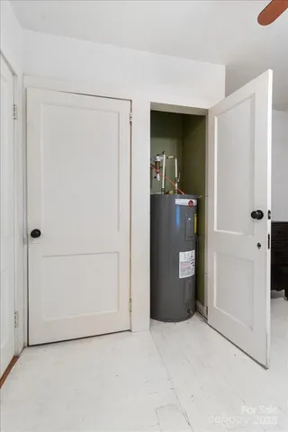 a en suite bathroom with a granite countertop sink and a mirror