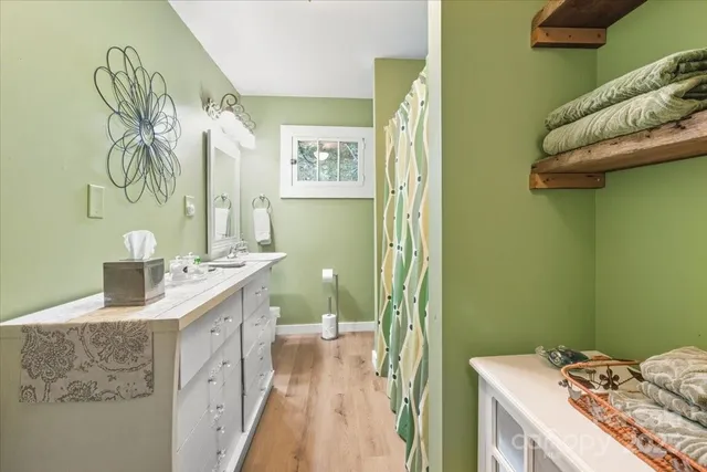 a room with a baby crib furniture and dresser