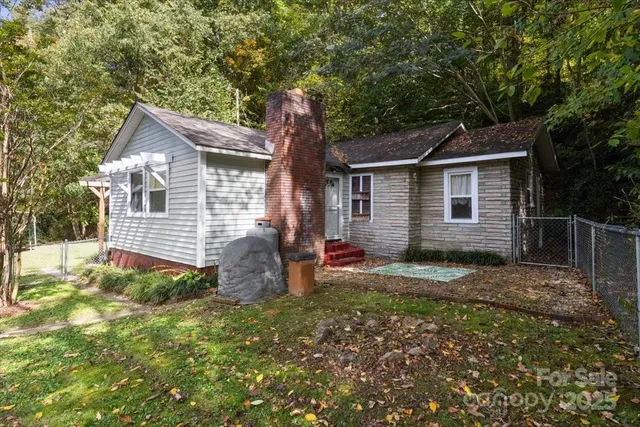 a backyard of a house with seating space