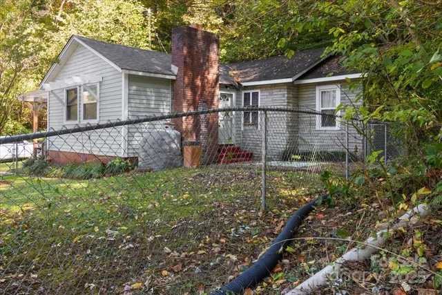 a backyard of a house with lots of green space