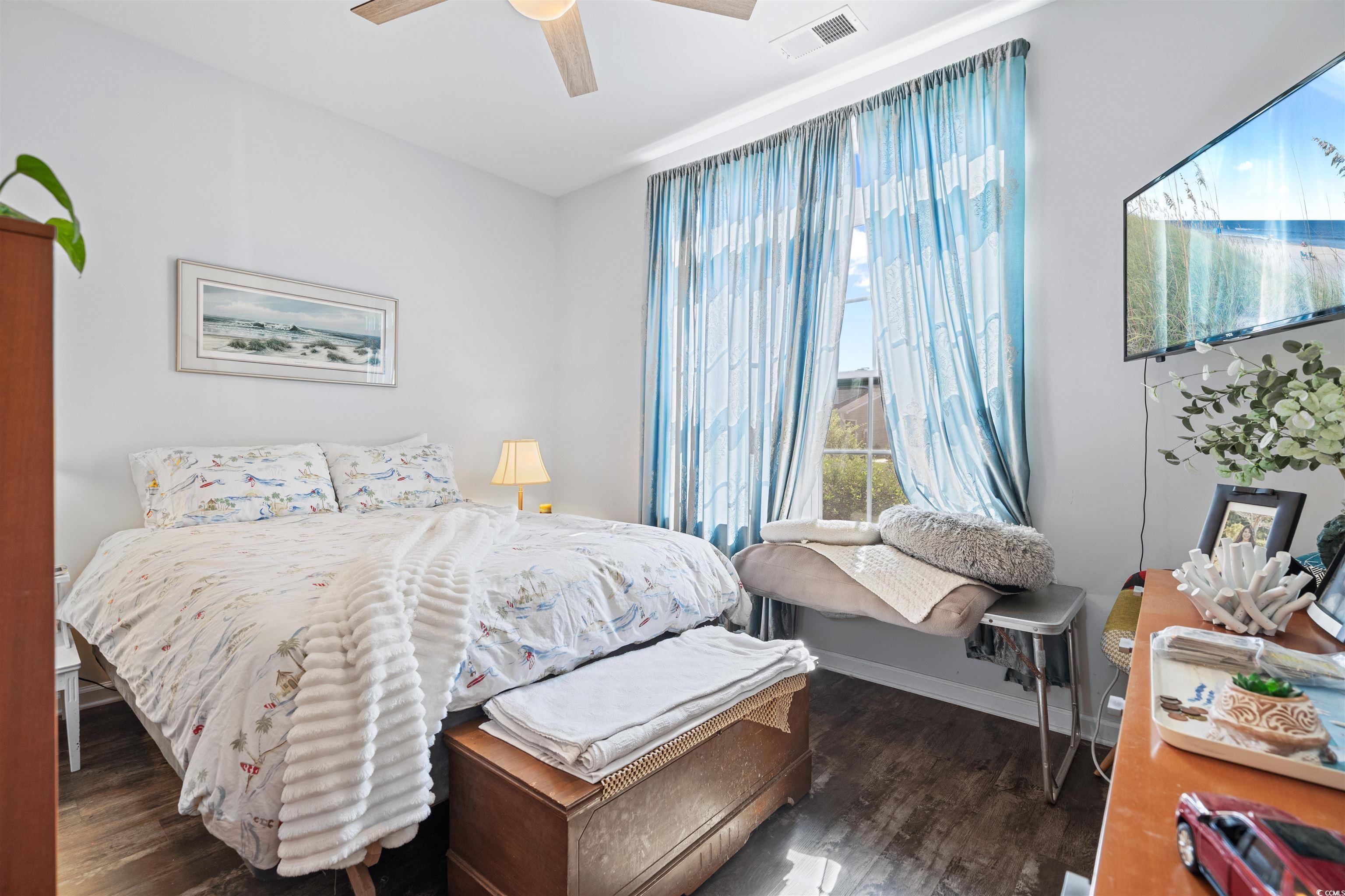 826 Cypress Way Little River, SC 29566 - Photo 25 of 40 Bedroom featuring dark wood-style flooring and a ceiling fan