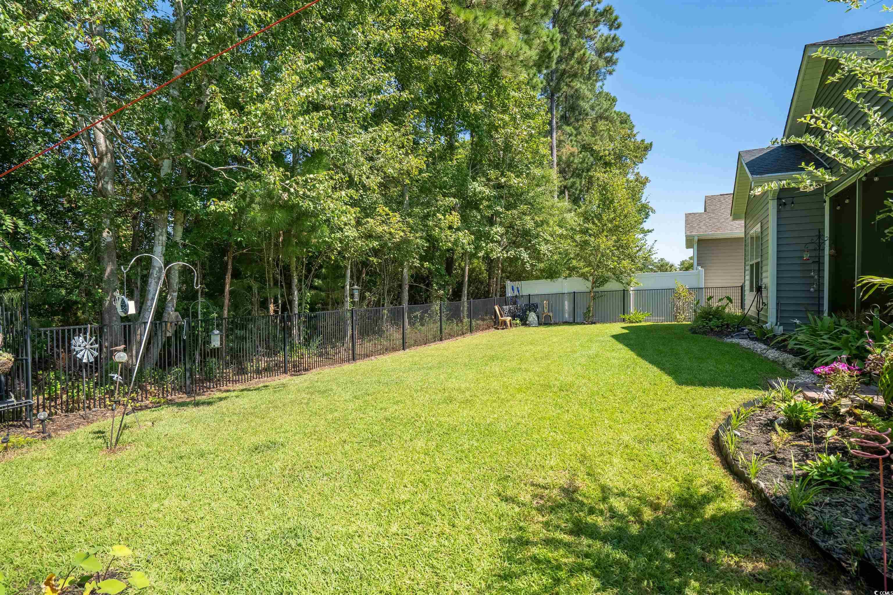 826 Cypress Way Little River, SC 29566 - Photo 32 of 40 View of fenced backyard