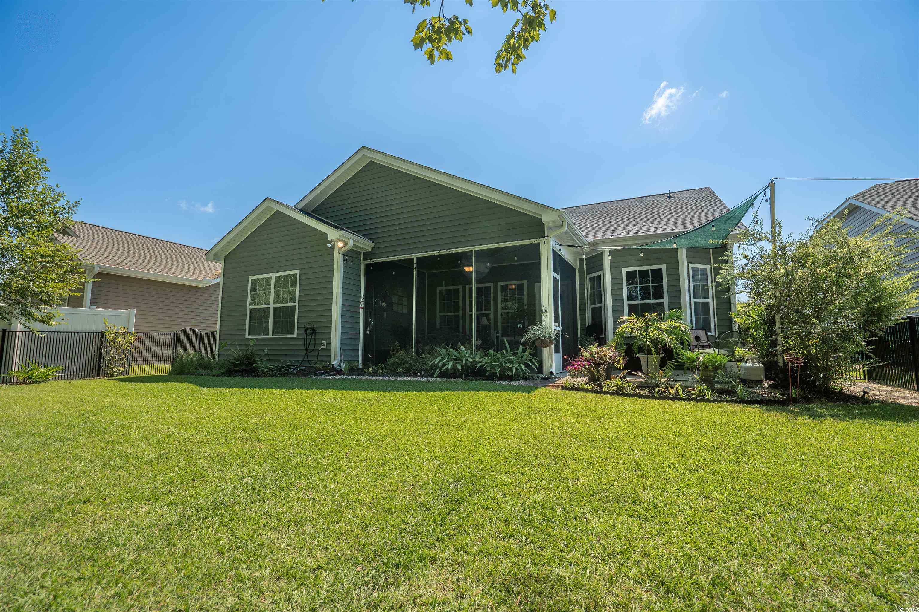 826 Cypress Way Little River, SC 29566 - Photo 34 of 40 Back of house featuring a sunroom