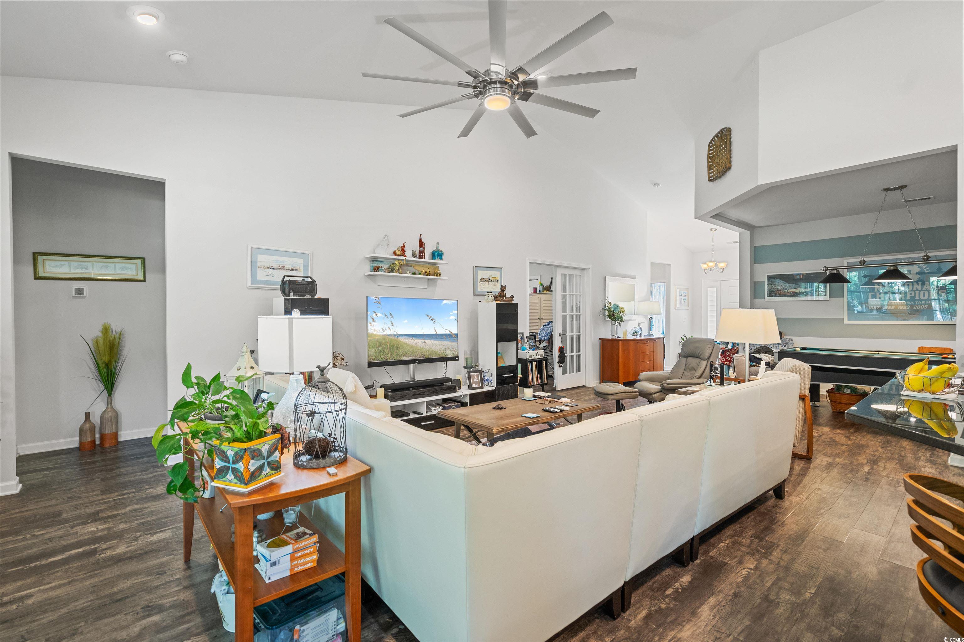 826 Cypress Way Little River, SC 29566 - Photo 10 of 40 Living area with dark wood-type flooring, plenty of natural light, high vaulted ceiling, and a ceiling fan