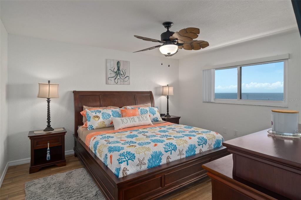 8211 Brent Street, Unit 847 Port Richey, FL 34668 - Photo 20 of 29 a bedroom with a bed and a chandelier