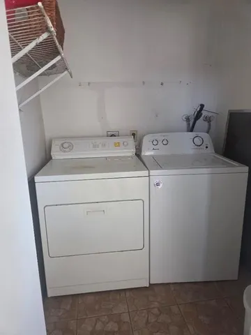 a utility room with dryer and washer