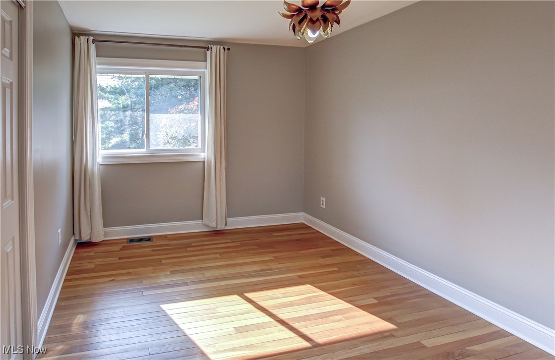 12477 Webster Road Strongsville, OH 44136 - Photo 17 of 40 Empty room with light hardwood / wood-style floors