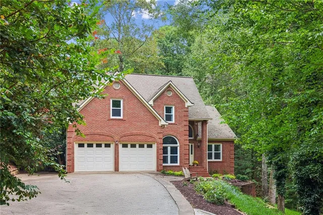 a view of a lake with lots of trees