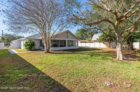 a house with trees in front of it