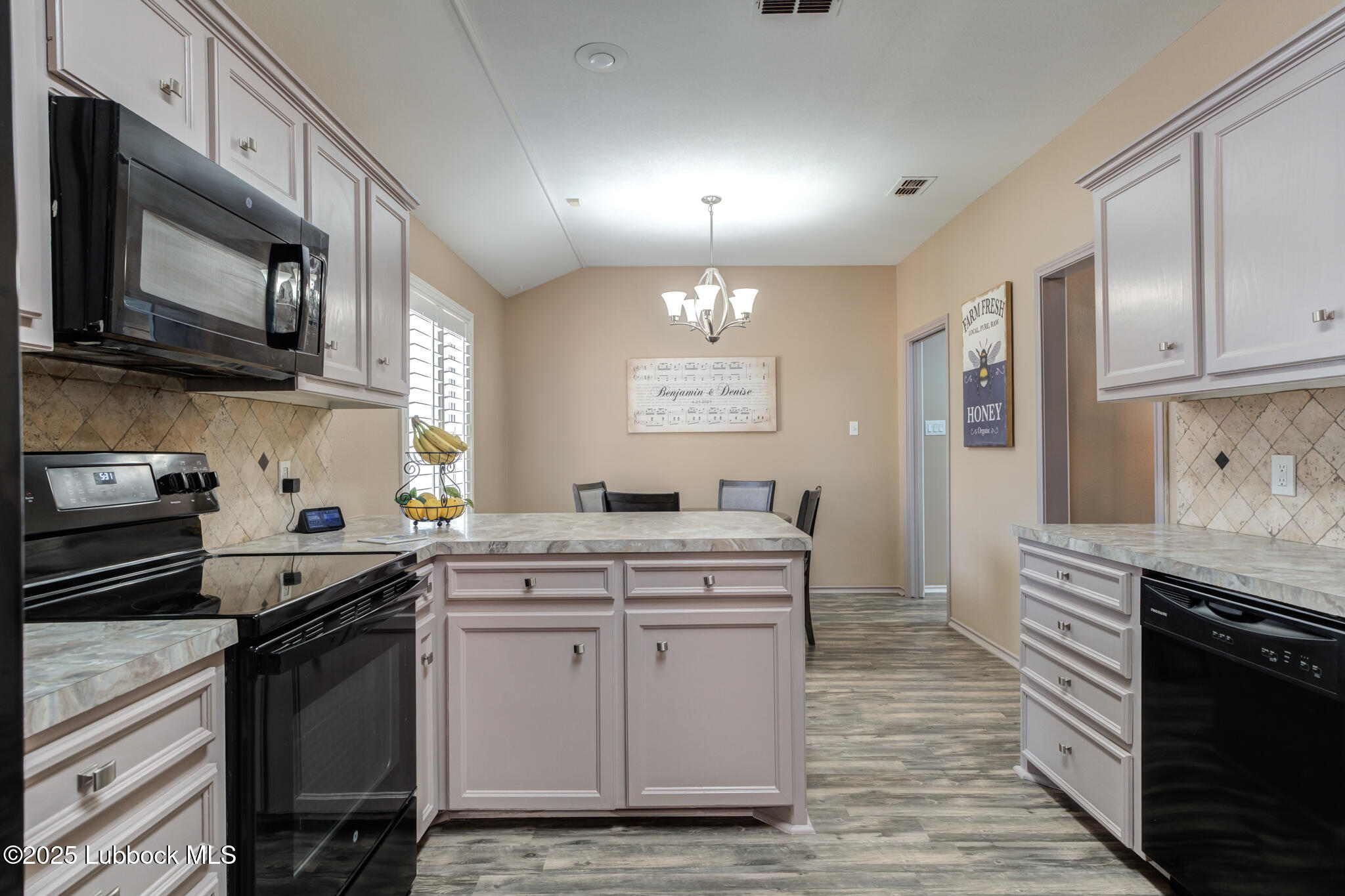 144 North Utica Avenue Lubbock, TX 79416 - Photo 16 of 46 a kitchen with a sink stove and microwave