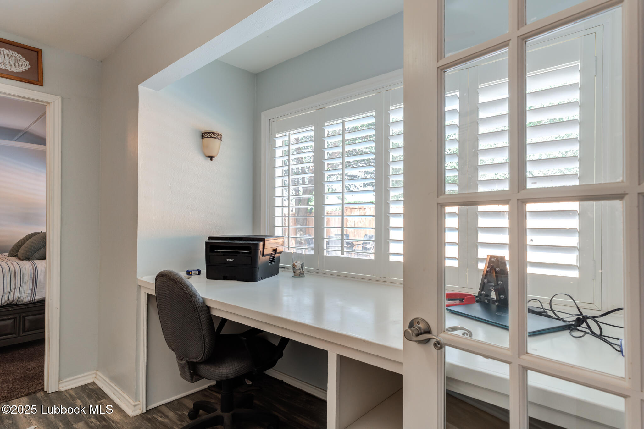 144 North Utica Avenue Lubbock, TX 79416 - Photo 20 of 46 a view of a workspace with furniture and a window