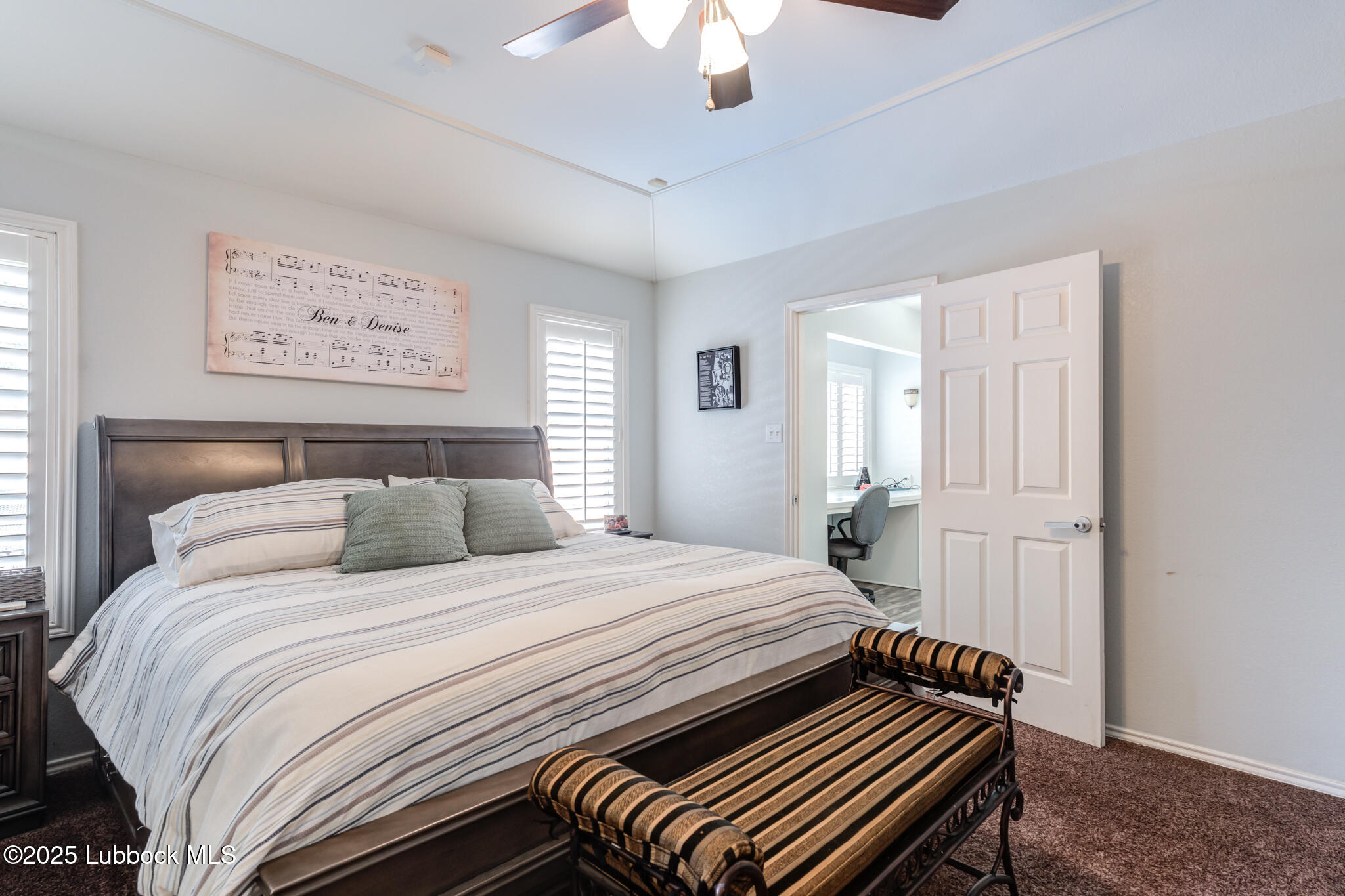 144 North Utica Avenue Lubbock, TX 79416 - Photo 23 of 46 a bedroom with a bed and a chandelier