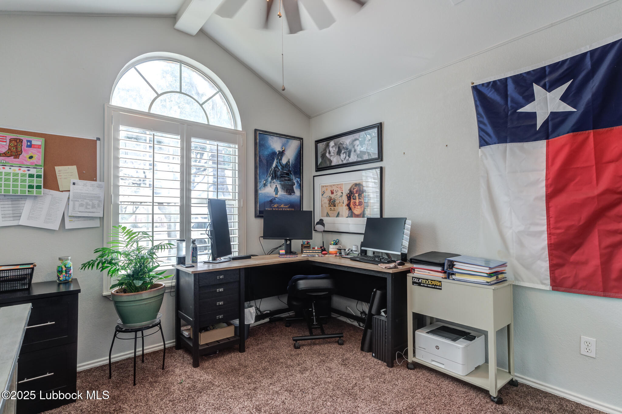 144 North Utica Avenue Lubbock, TX 79416 - Photo 29 of 46 a view of a workspace with a window and a couch