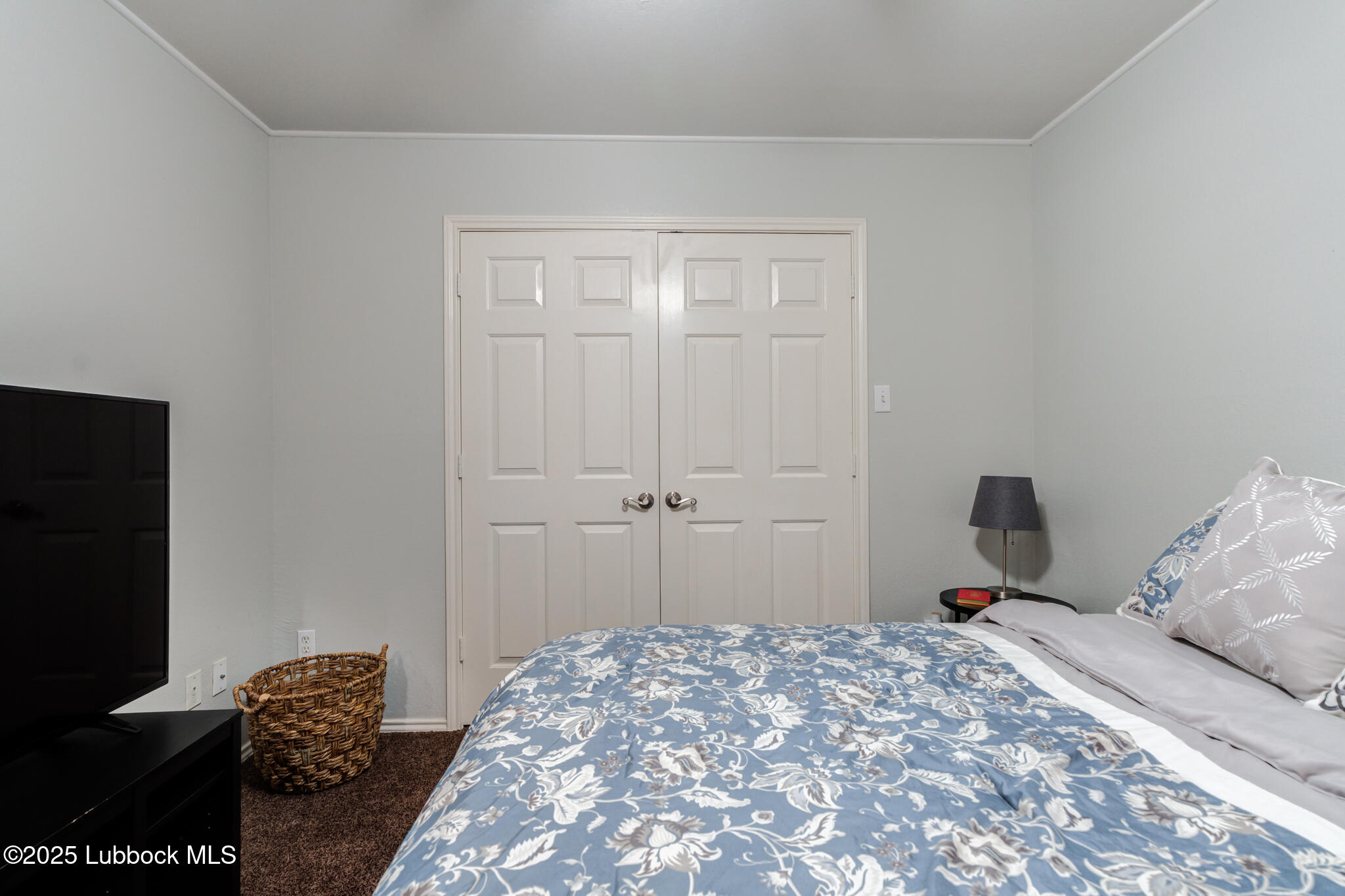 144 North Utica Avenue Lubbock, TX 79416 - Photo 32 of 46 a bedroom with a bed and a rug