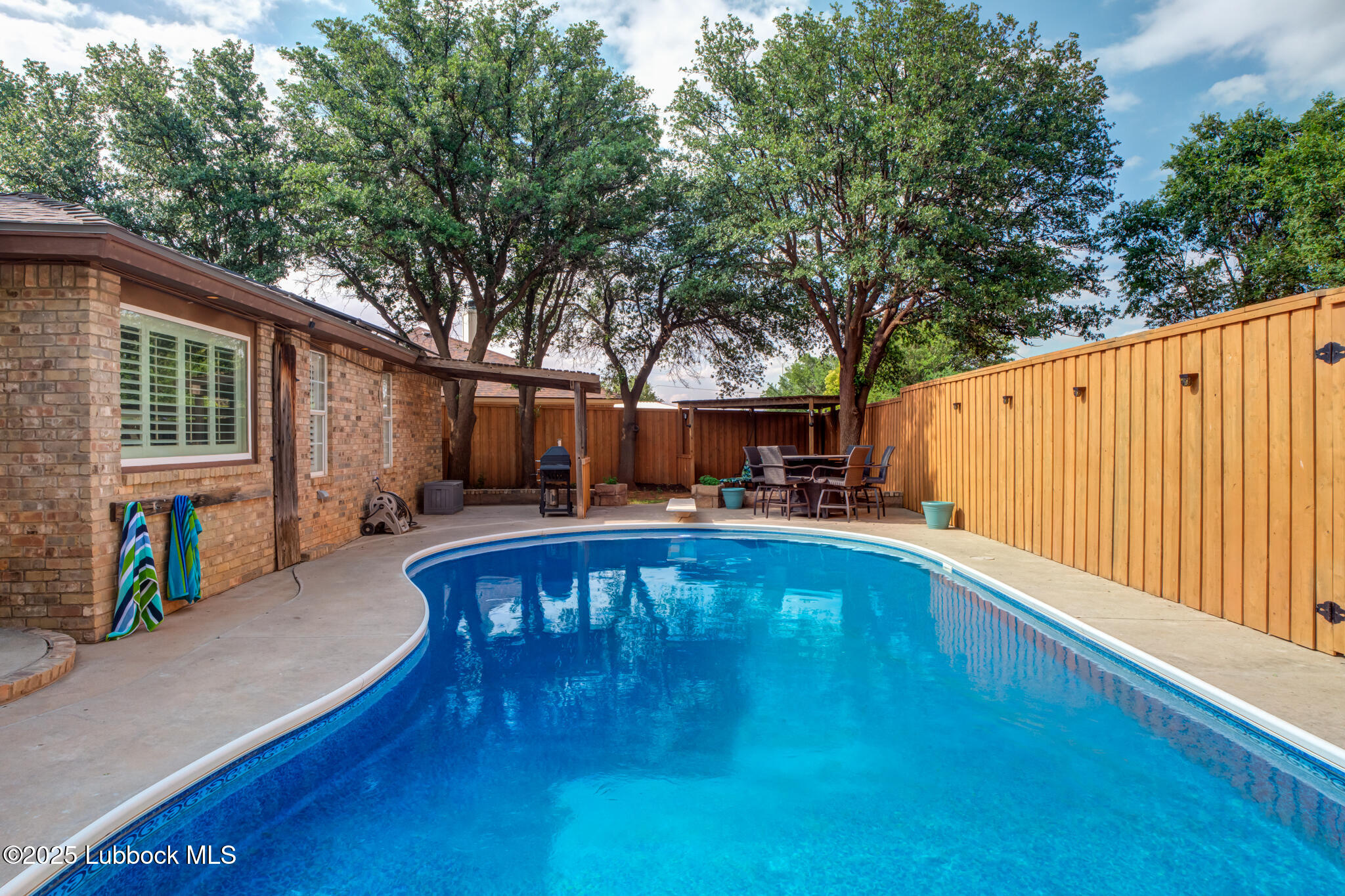 144 North Utica Avenue Lubbock, TX 79416 - Photo 41 of 46 a view of swimming pool with seating space