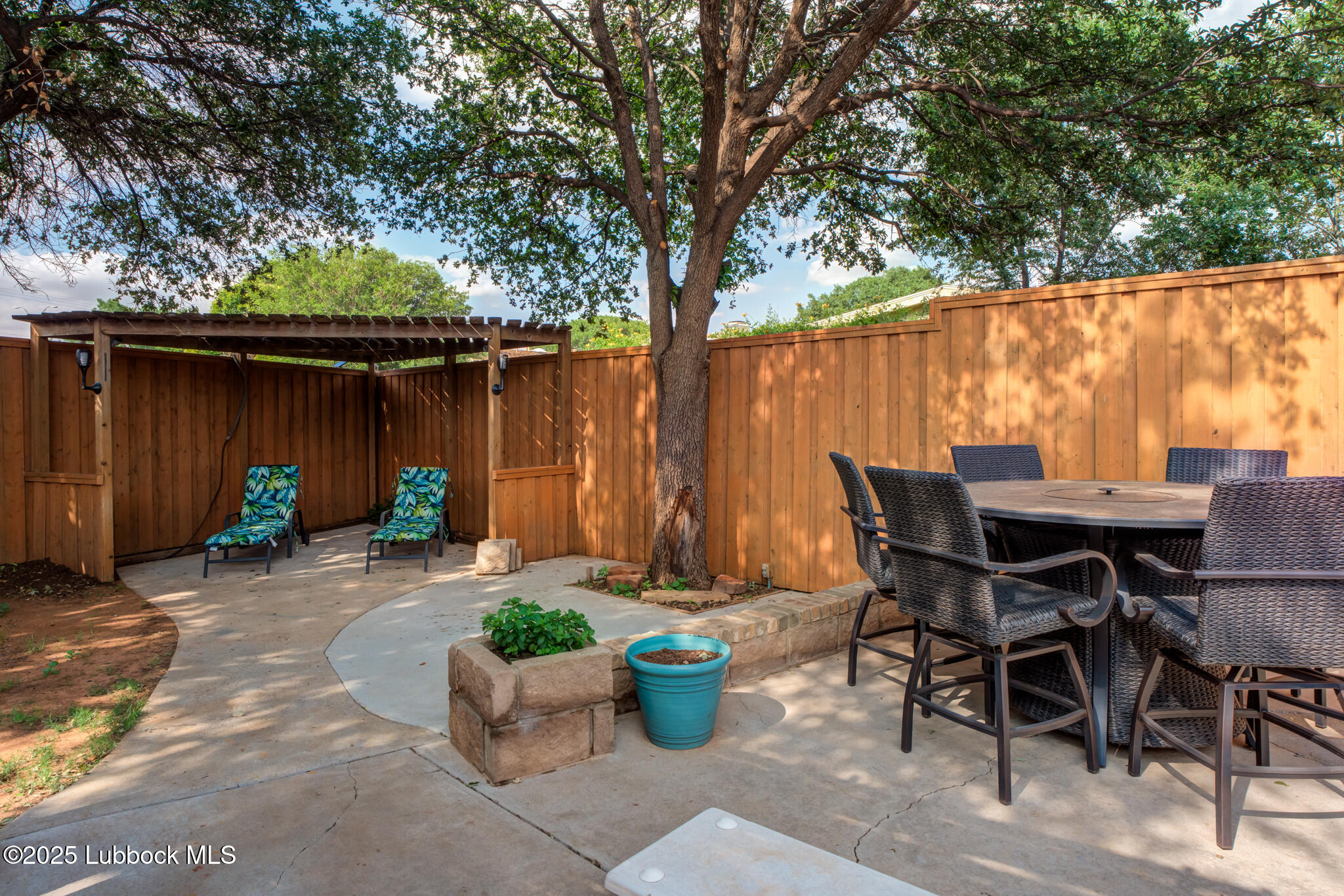 144 North Utica Avenue Lubbock, TX 79416 - Photo 45 of 46 a backyard of a house with table and chairs
