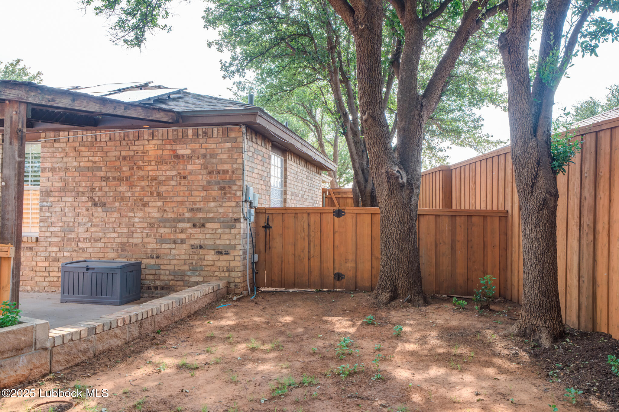 144 North Utica Avenue Lubbock, TX 79416 - Photo 46 of 46 a backyard of a house with a tree