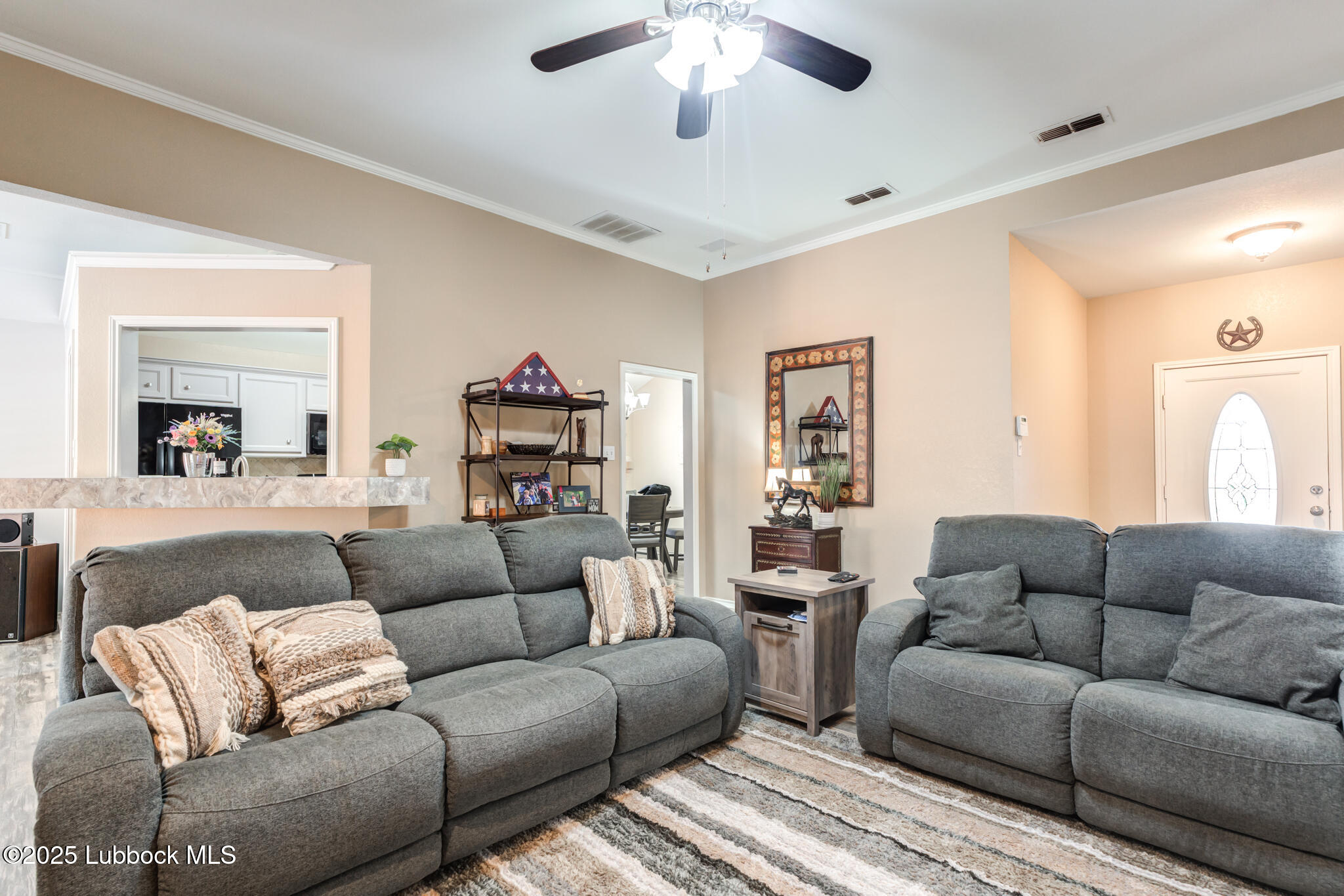 144 North Utica Avenue Lubbock, TX 79416 - Photo 7 of 46 a living room with furniture and a ceiling fan