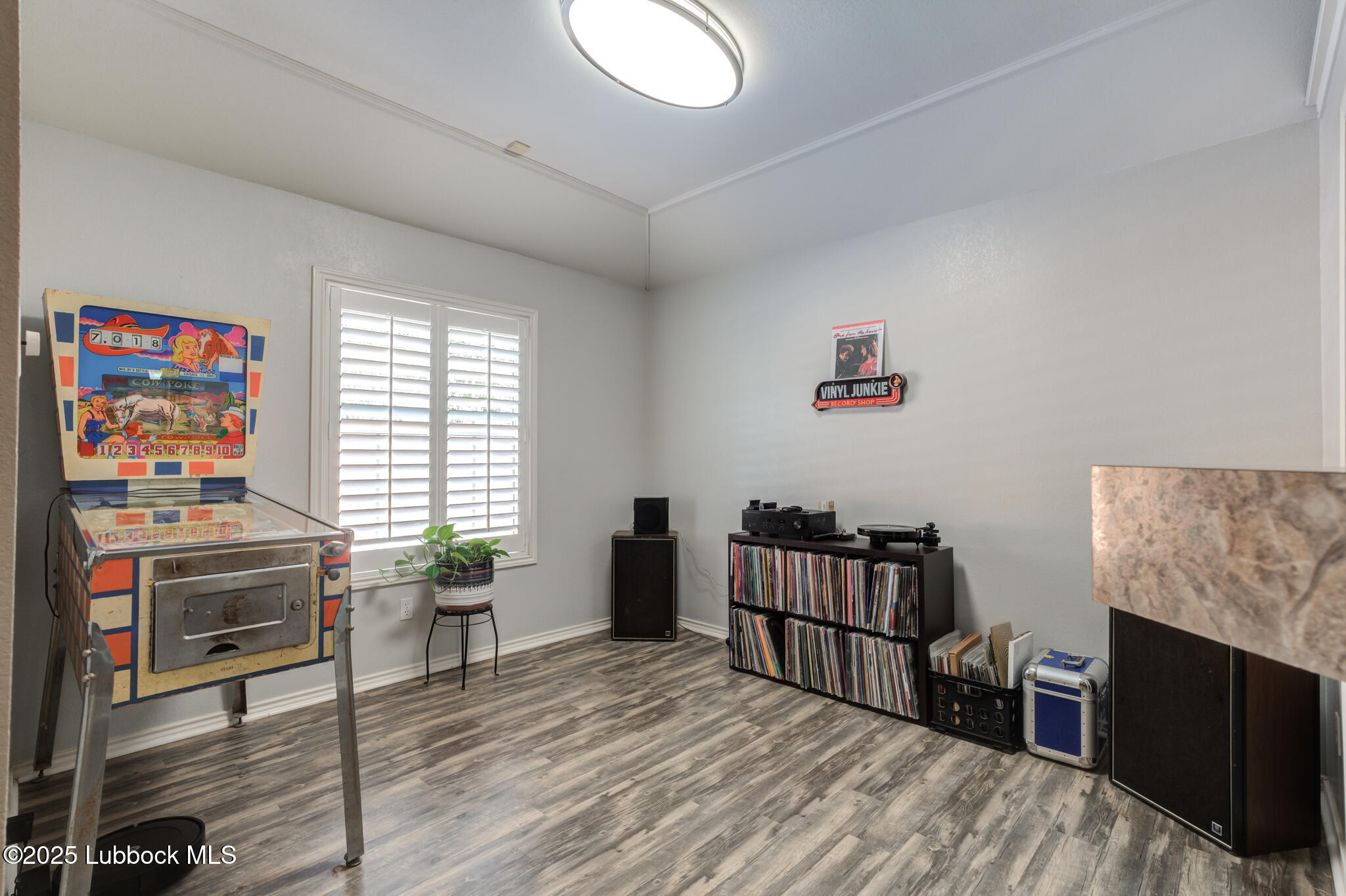 144 North Utica Avenue Lubbock, TX 79416 - Photo 10 of 46 a bedroom with furniture and a window