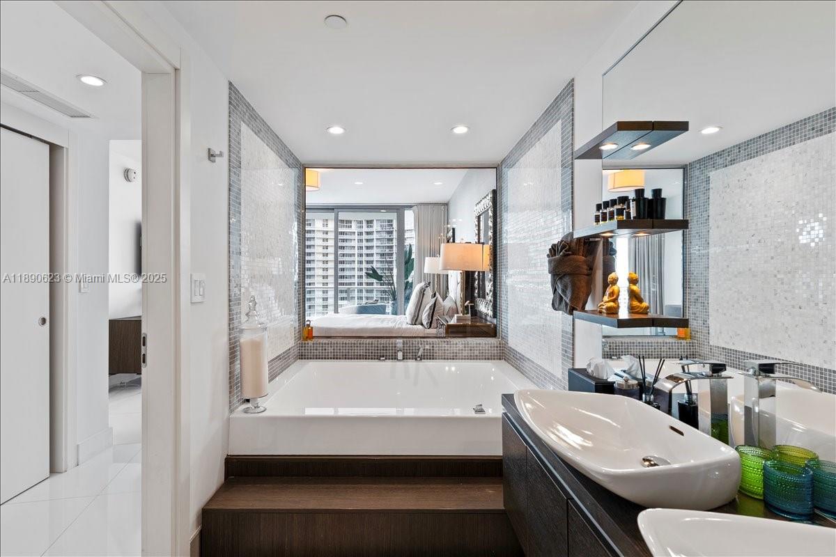200 Biscayne Blvd Way, Unit 3608 Miami, FL 33131 - Photo 15 of 31 a bathroom with a sink and a bathtub
