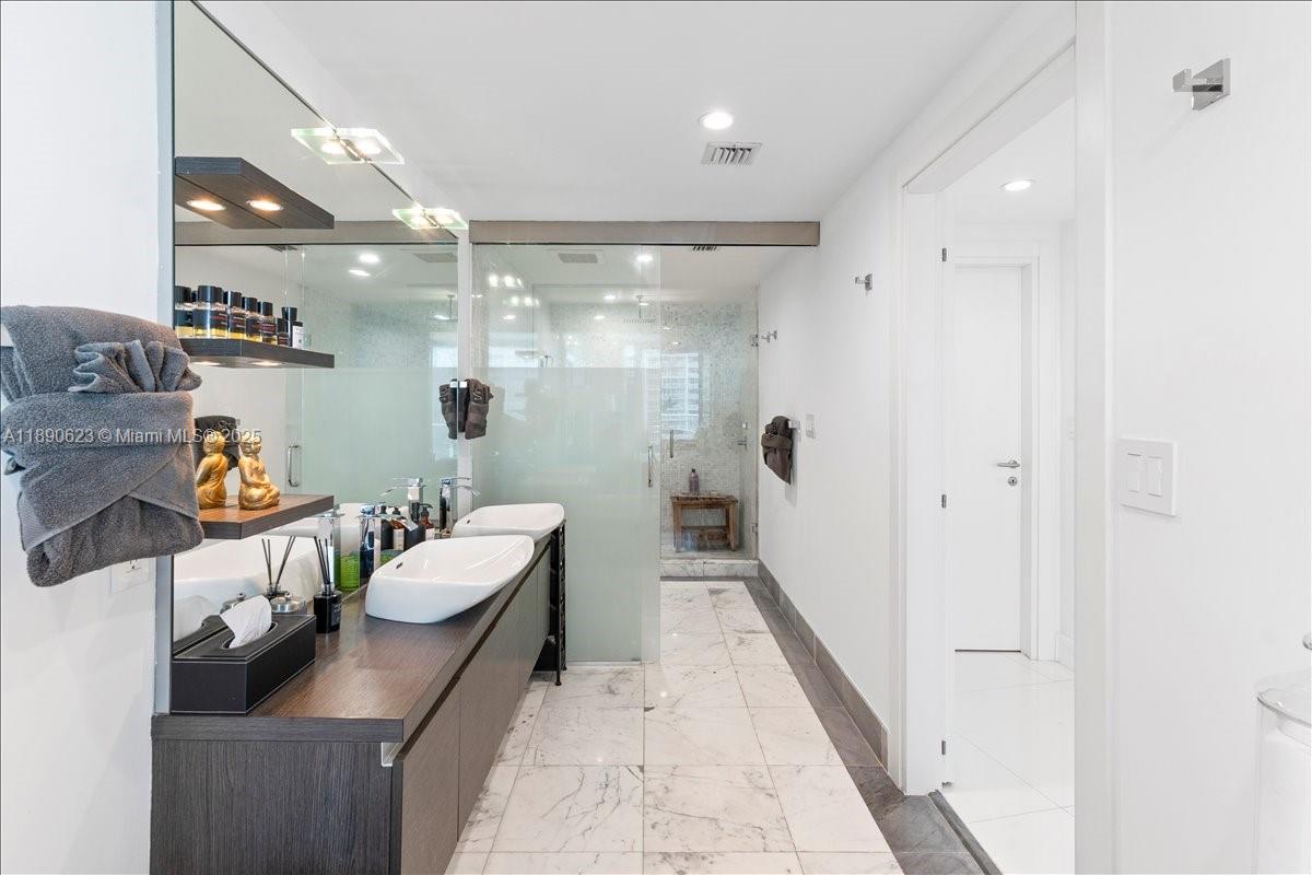 200 Biscayne Blvd Way, Unit 3608 Miami, FL 33131 - Photo 17 of 31 a room with furniture and a chandelier