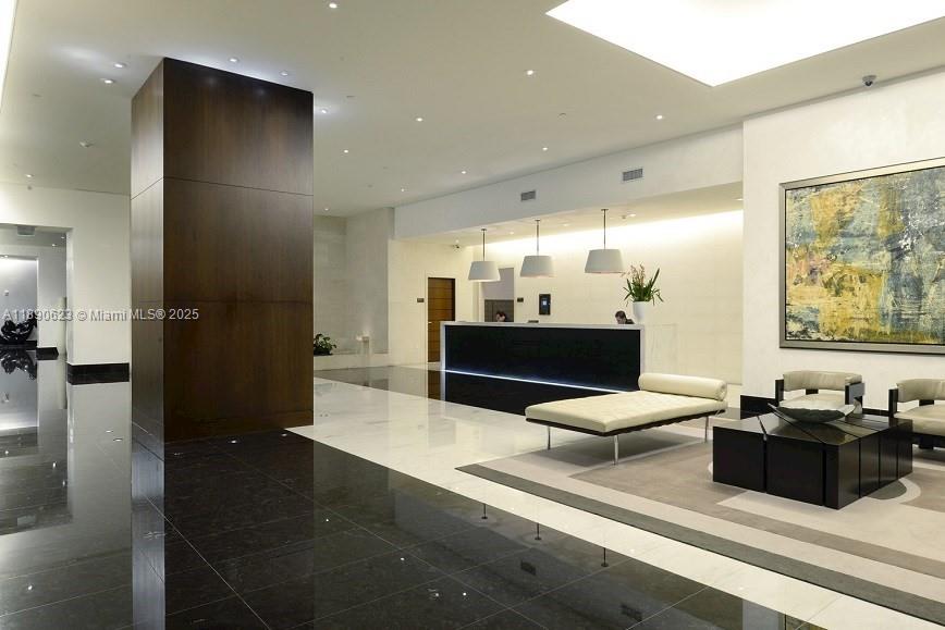 200 Biscayne Blvd Way, Unit 3608 Miami, FL 33131 - Photo 25 of 31 a living room with stainless steel appliances kitchen island granite countertop furniture and a large window