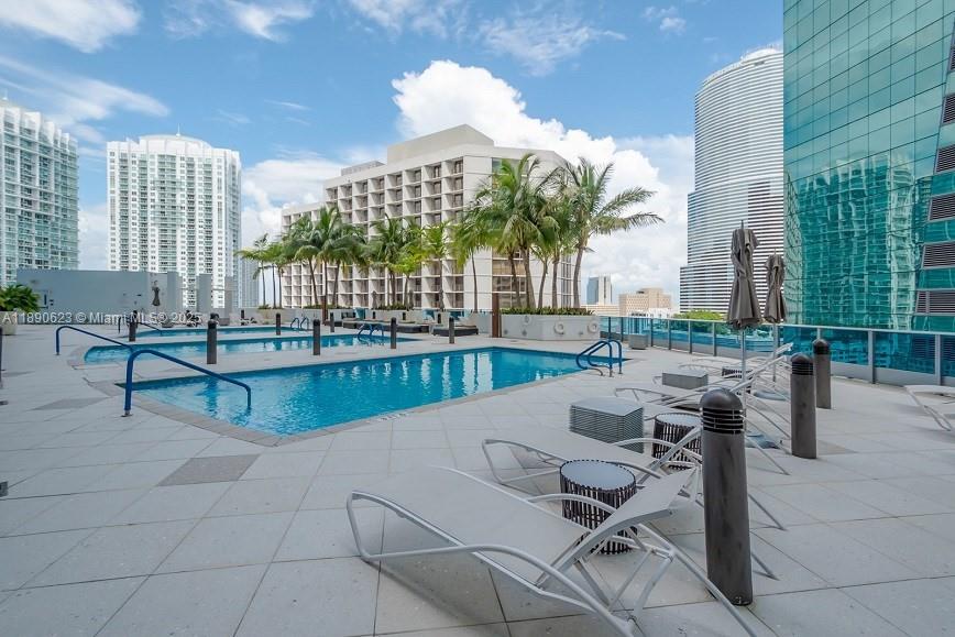 200 Biscayne Blvd Way, Unit 3608 Miami, FL 33131 - Photo 28 of 31 a swimming pool with outdoor seating and a garden