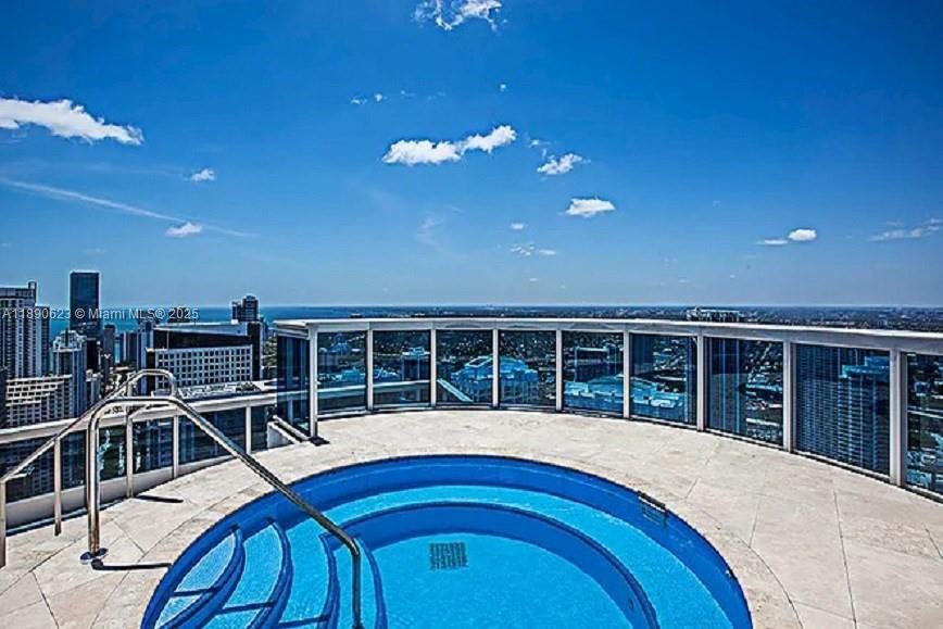 200 Biscayne Blvd Way, Unit 3608 Miami, FL 33131 - Photo 30 of 31 a view of a chair and table in the patio