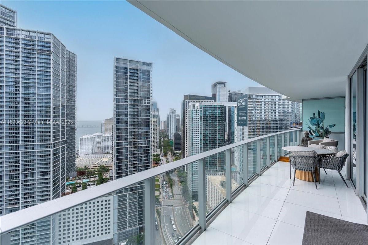 200 Biscayne Blvd Way, Unit 3608 Miami, FL 33131 - Photo 3 of 31 a balcony with chairs