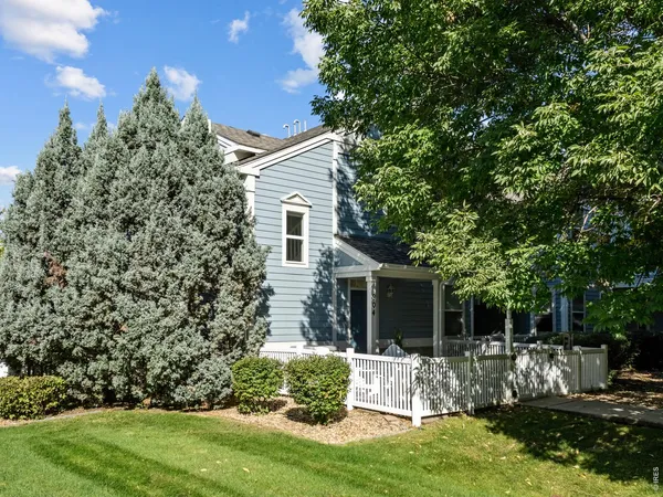 a view of house with backyard and outdoor seating