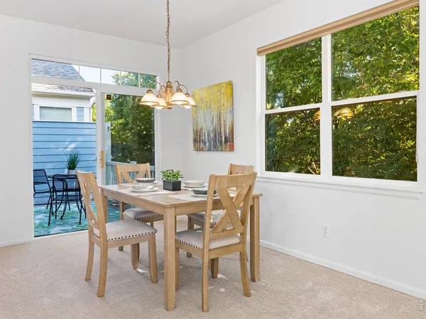 a view of a dining room with furniture window and outside view