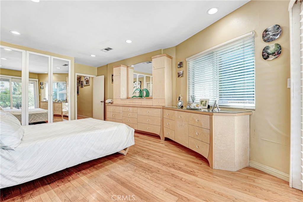 4313 Rhodes Avenue Studio City, CA 91604 - Photo 11 of 23 a bedroom with a large bed and a large window