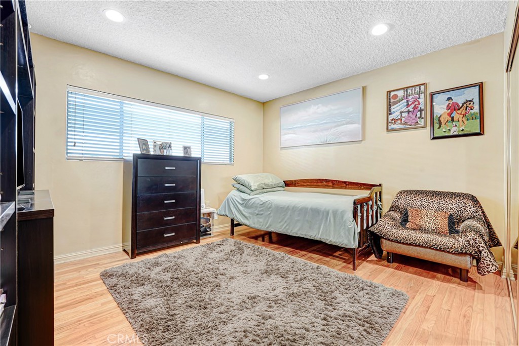 4313 Rhodes Avenue Studio City, CA 91604 - Photo 12 of 23 a bedroom with a bed and a couch