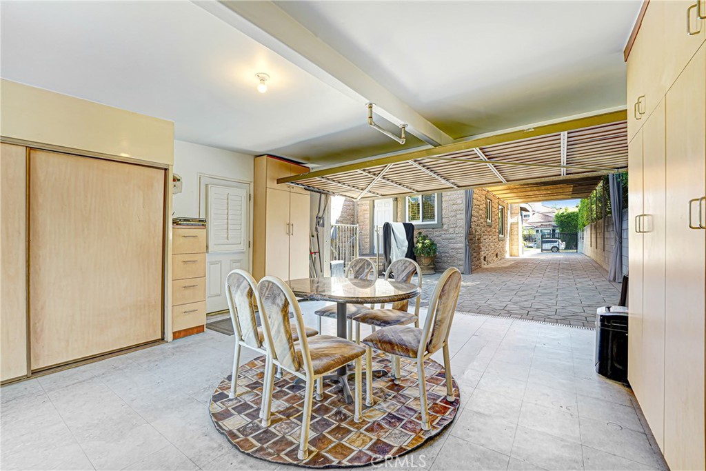 4313 Rhodes Avenue Studio City, CA 91604 - Photo 19 of 23 a dining room with furniture a large window and red carpet