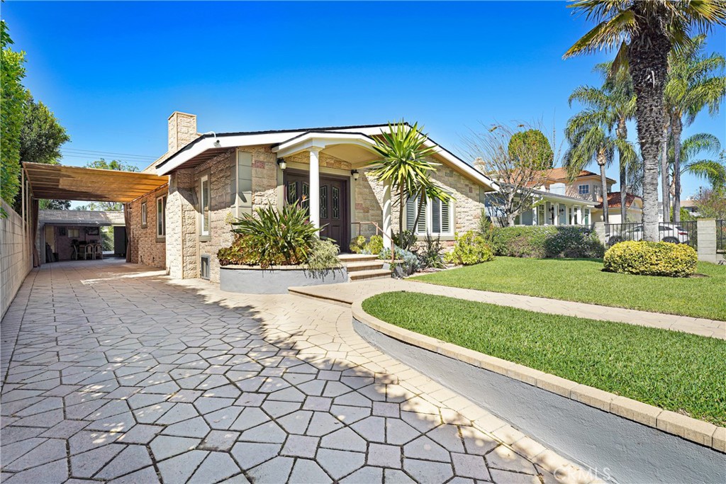 4313 Rhodes Avenue Studio City, CA 91604 - Photo 22 of 23 a front view of a house with a yard