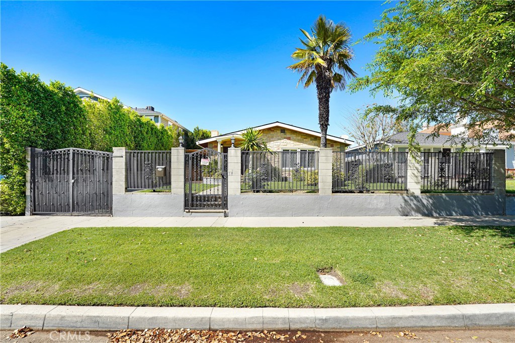 4313 Rhodes Avenue Studio City, CA 91604 - Photo 23 of 23 a view of a house with a yard and palm tree