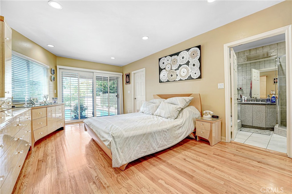 4313 Rhodes Avenue Studio City, CA 91604 - Photo 10 of 23 a spacious bedroom with a large bed and a large window