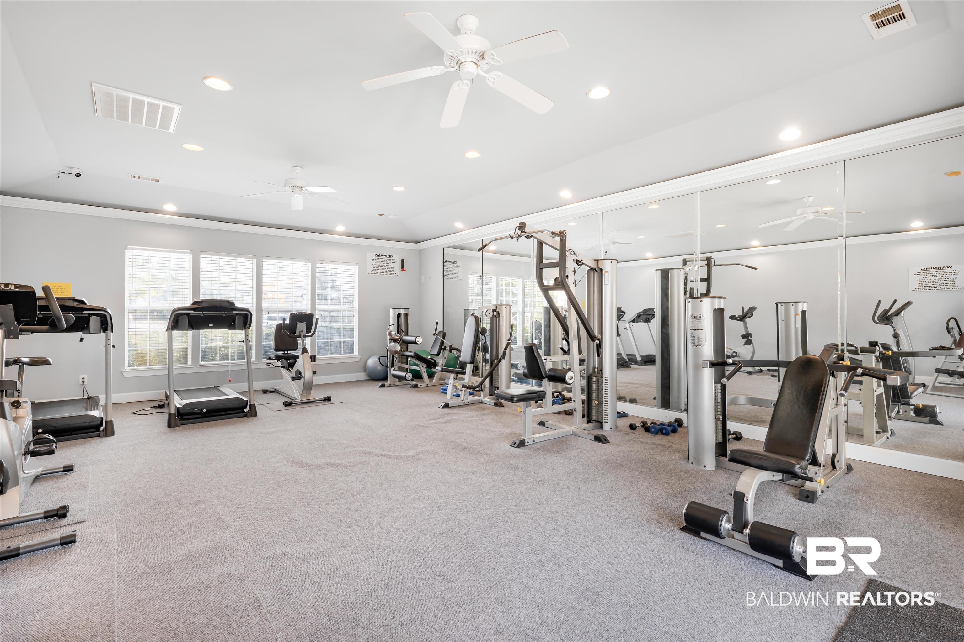 1517 Regency Road, Unit 68 Gulf Shores, AL 36542 - Photo 35 of 43 Exercise room with ceiling fan and ornamental molding