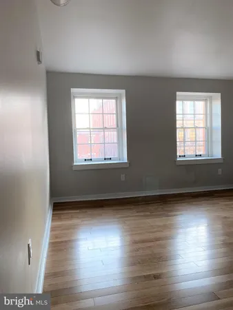 a view of an empty room with a large window