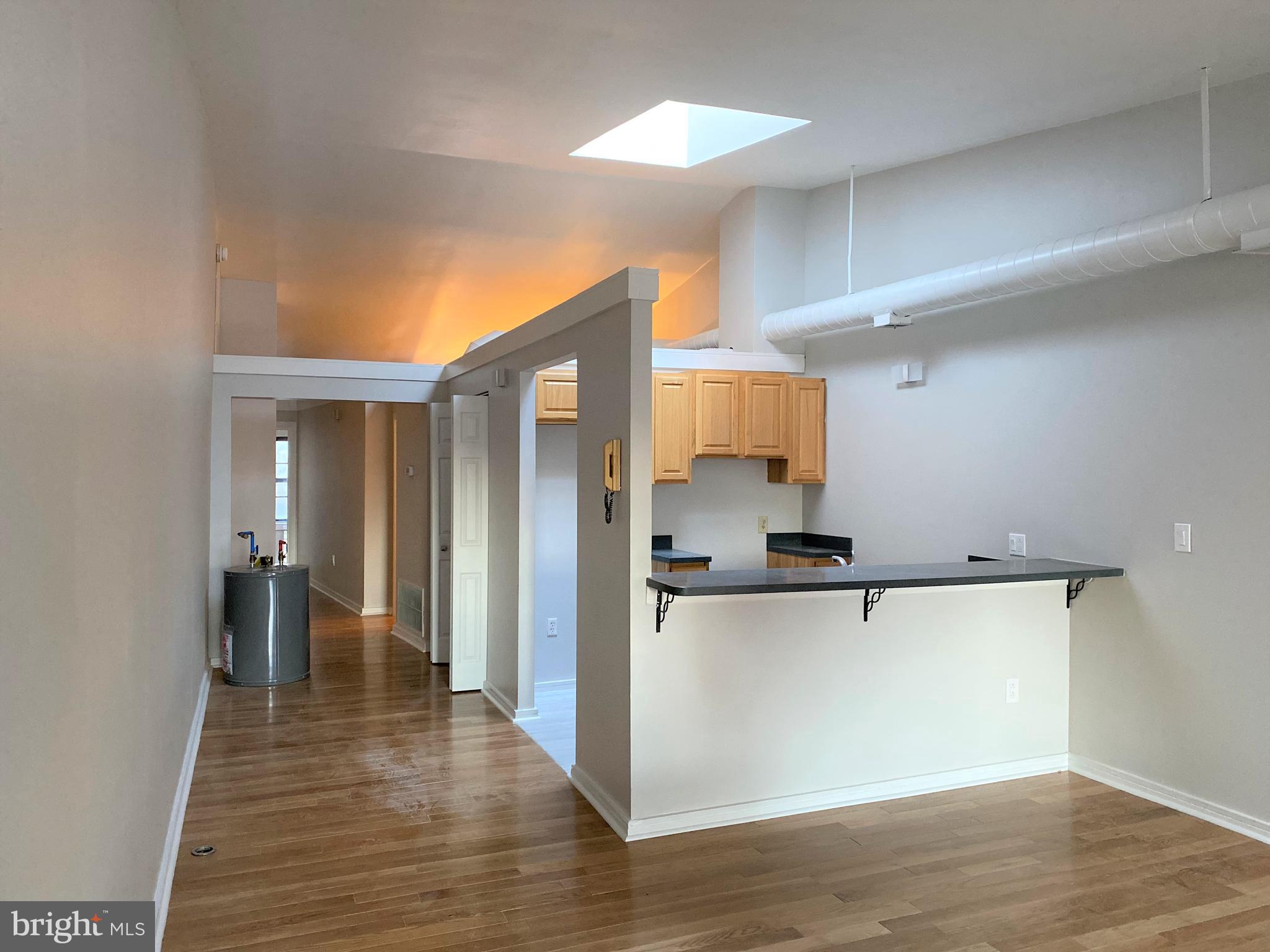 222 Church Street, Unit 4K Philadelphia, PA 19106 - Photo 16 of 16 a view of a kitchen with a refrigerator and a stove