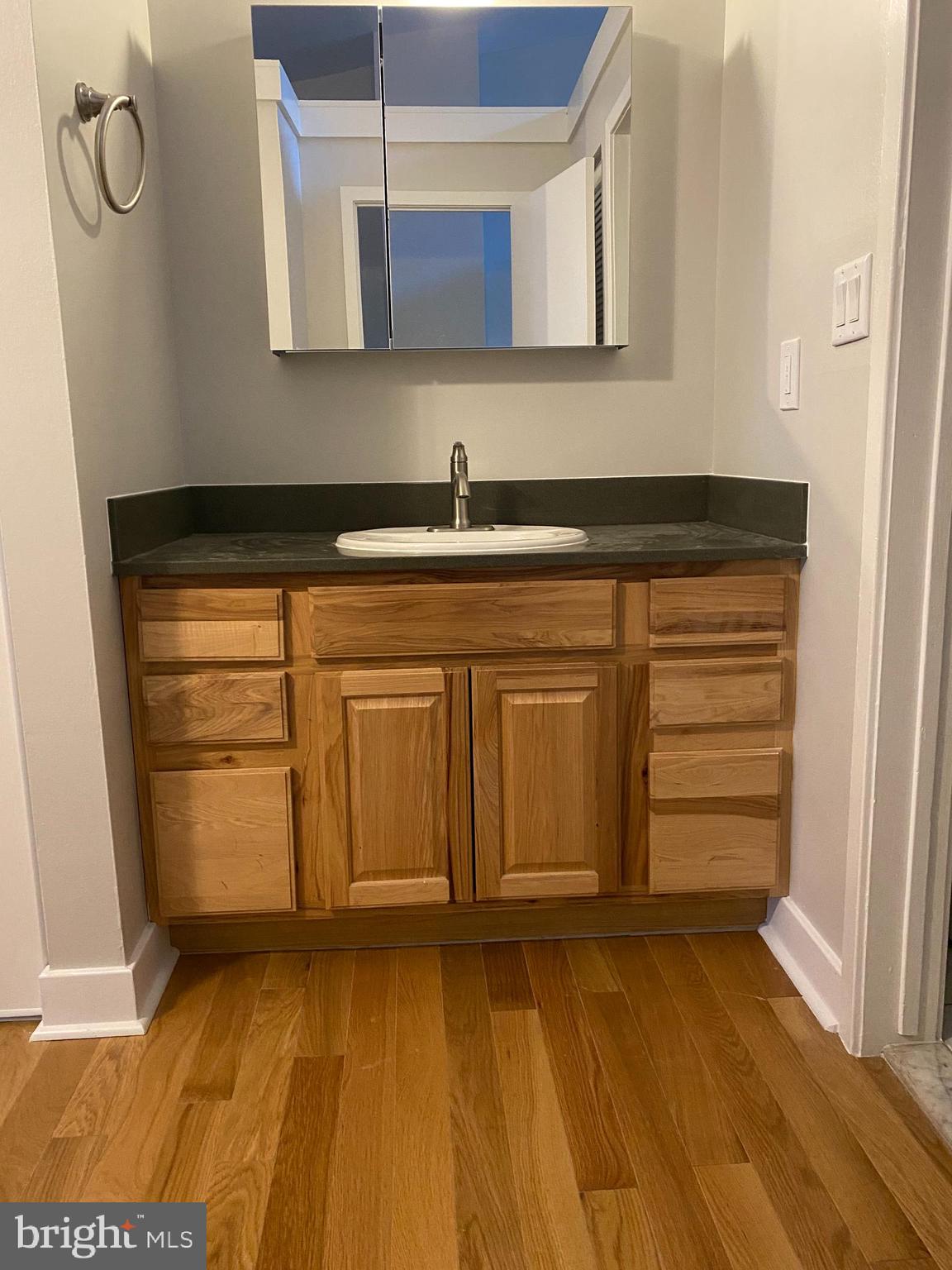 222 Church Street, Unit 4K Philadelphia, PA 19106 - Photo 10 of 16 a bathroom with a sink and a mirror