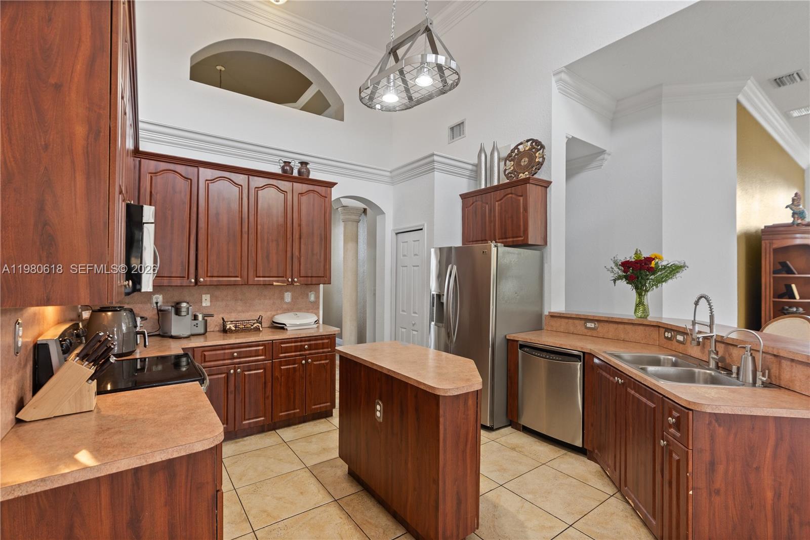 12981 Southwest 197th Street Miami, FL 33177 - Photo 13 of 75 a kitchen with stainless steel appliances granite countertop a sink a stove and refrigerator