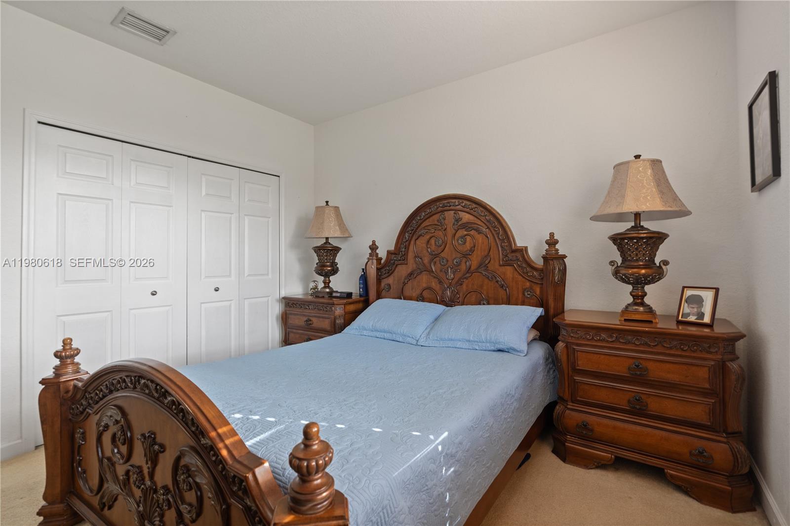 12981 Southwest 197th Street Miami, FL 33177 - Photo 28 of 75 a bedroom with a bed and a dresser