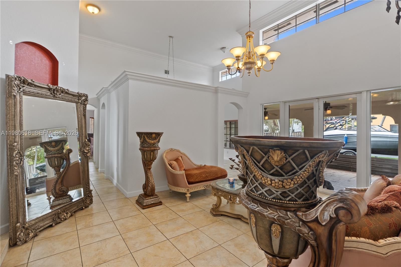 12981 Southwest 197th Street Miami, FL 33177 - Photo 3 of 75 a view of a dining room with furniture and chandelier