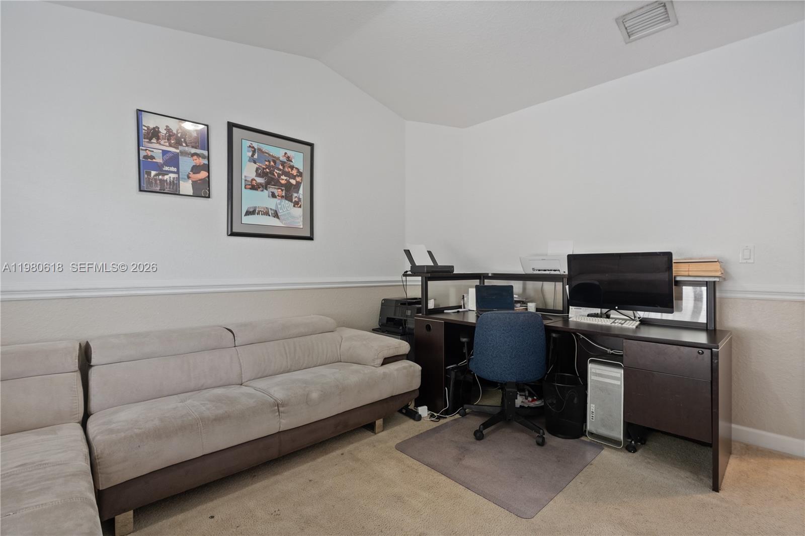 12981 Southwest 197th Street Miami, FL 33177 - Photo 47 of 75 a living room with furniture and a flat screen tv