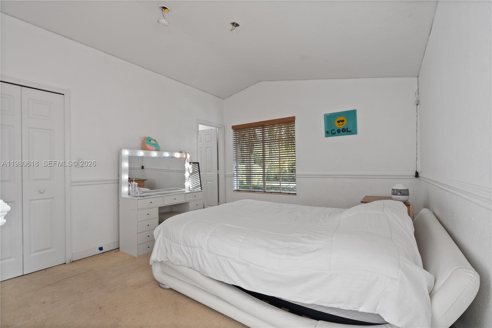 12981 Southwest 197th Street Miami, FL 33177 - Photo 49 of 75 a bedroom with a bed and a window