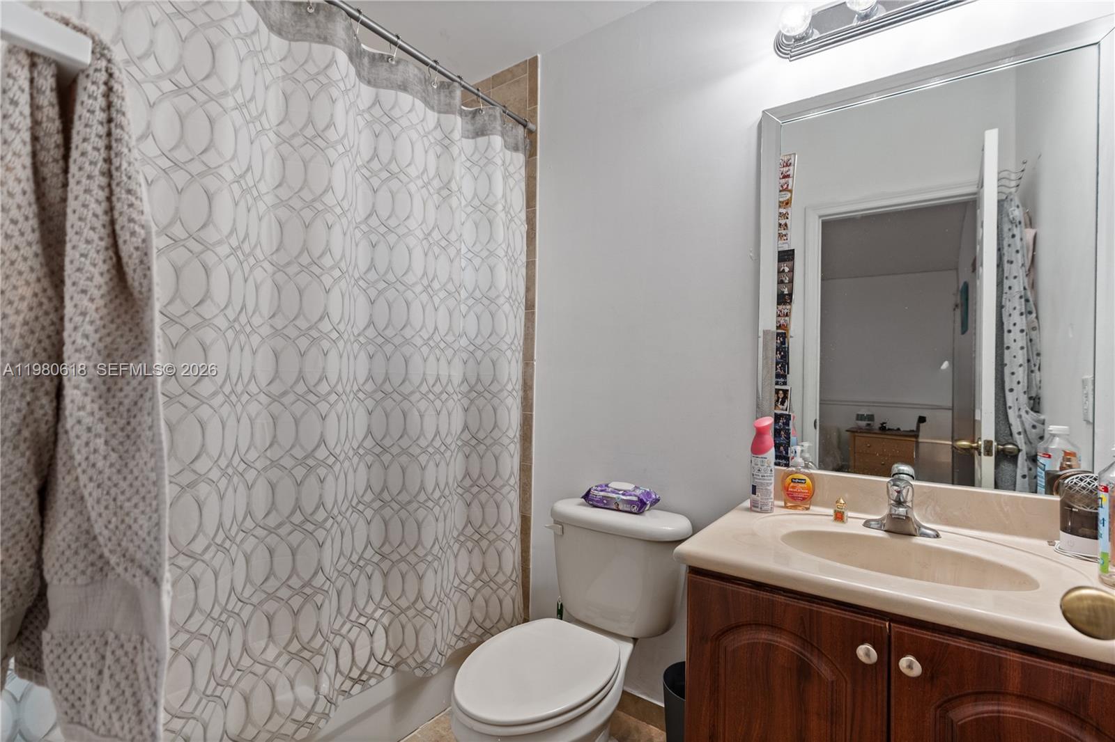 12981 Southwest 197th Street Miami, FL 33177 - Photo 51 of 75 a bathroom with a sink vanity mirror and toilet
