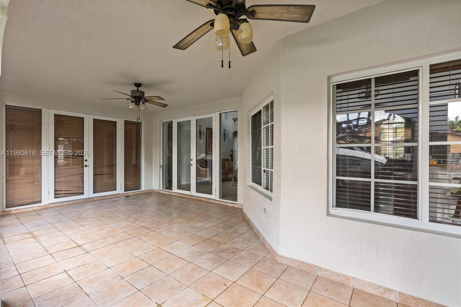 12981 Southwest 197th Street Miami, FL 33177 - Photo 59 of 75 a view of an empty room with a window