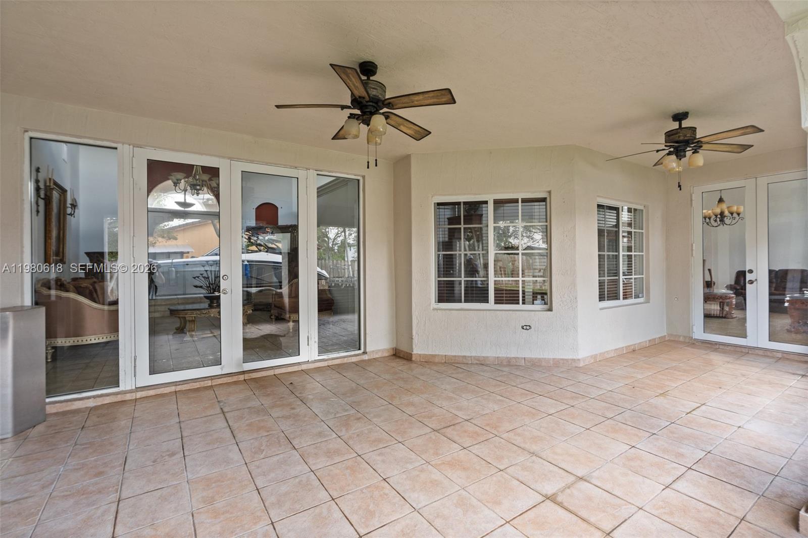 12981 Southwest 197th Street Miami, FL 33177 - Photo 60 of 75 a view of an entryway with a chandelier fan
