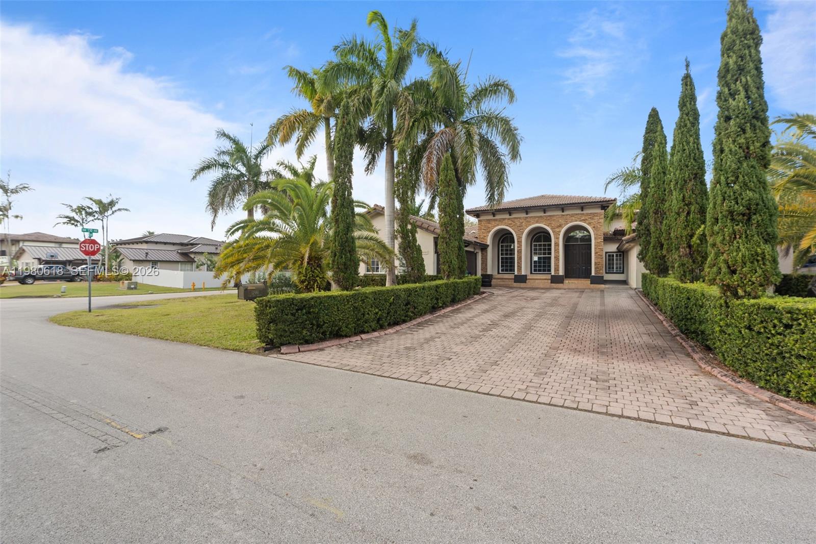 12981 Southwest 197th Street Miami, FL 33177 - Photo 61 of 75 front view of a house with a yard and potted plants